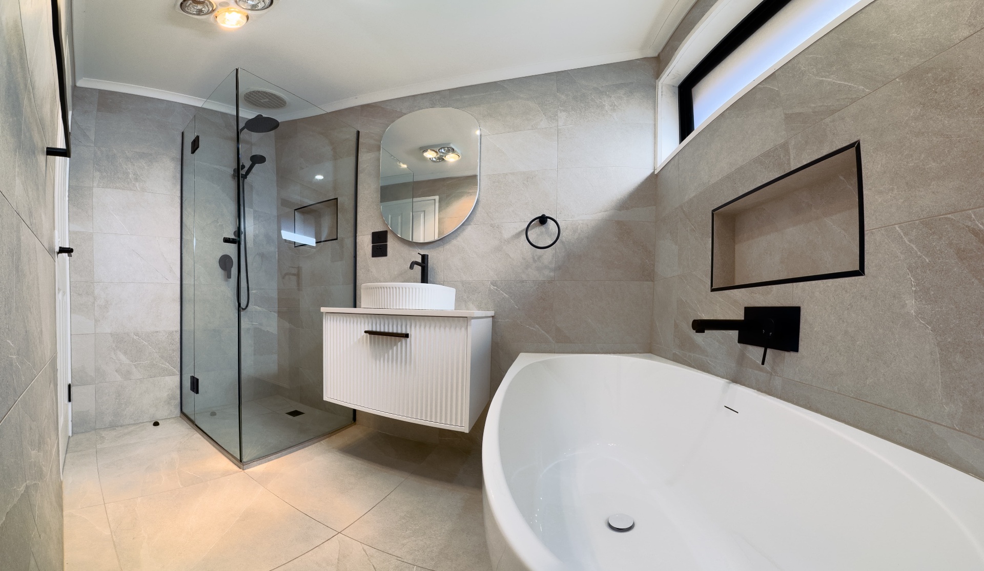 Bathroom showing shower, vanity and freestanding bath