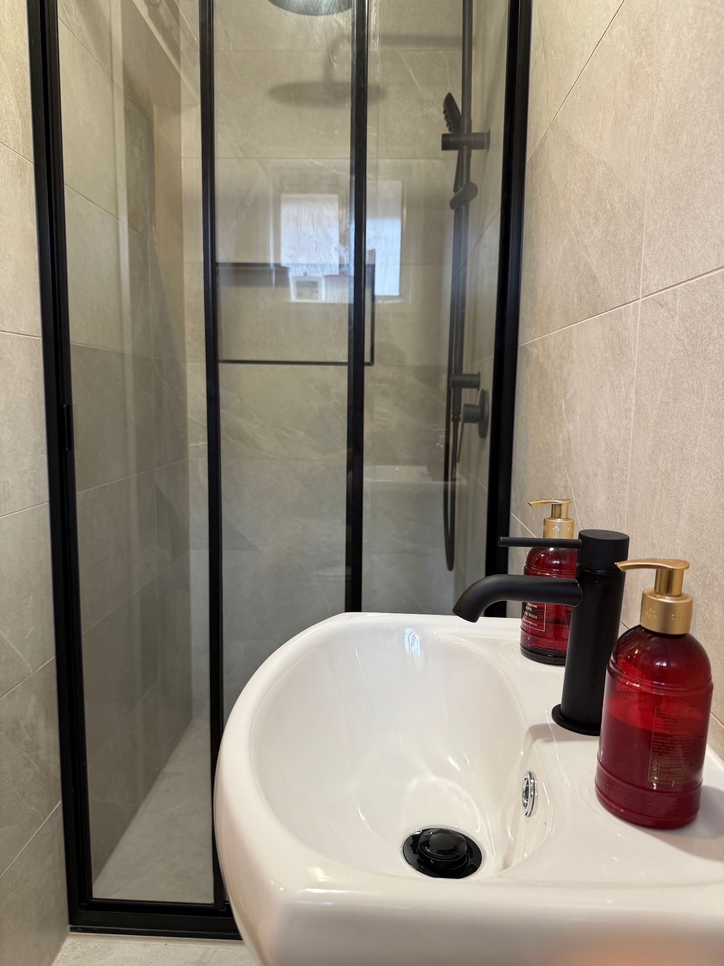 Framed matte black shower screen with rainfall head & rail shower